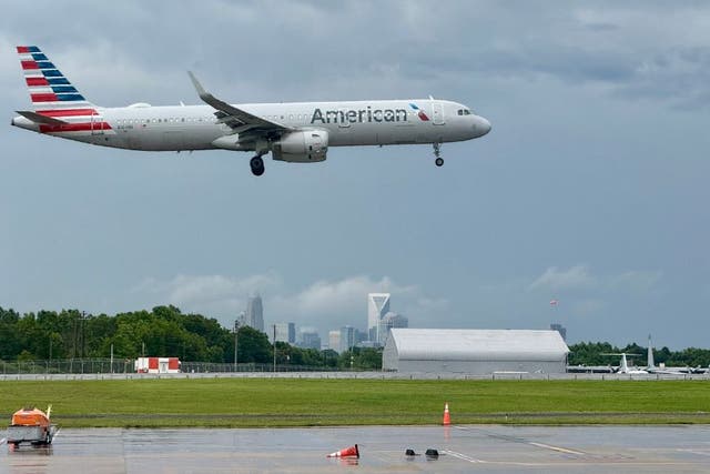 <p>Passengers and local observers reported seeing smoke and flames on an American Airlines plane departing from Las Vegas for Charlotte, North Carolina, on Wednesday morning. </p>