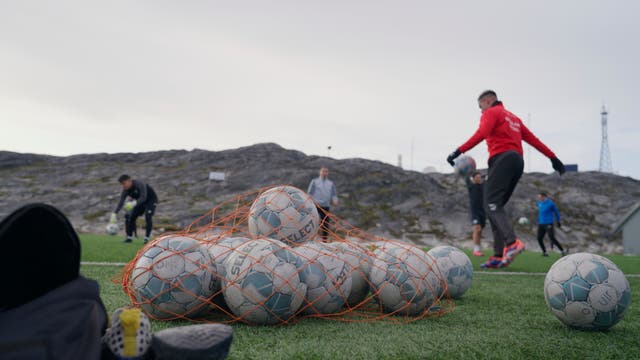 <p>Players take part in a training session at Nuuk stadium in Nuuk, Greenland, on 17 June 2025</p>