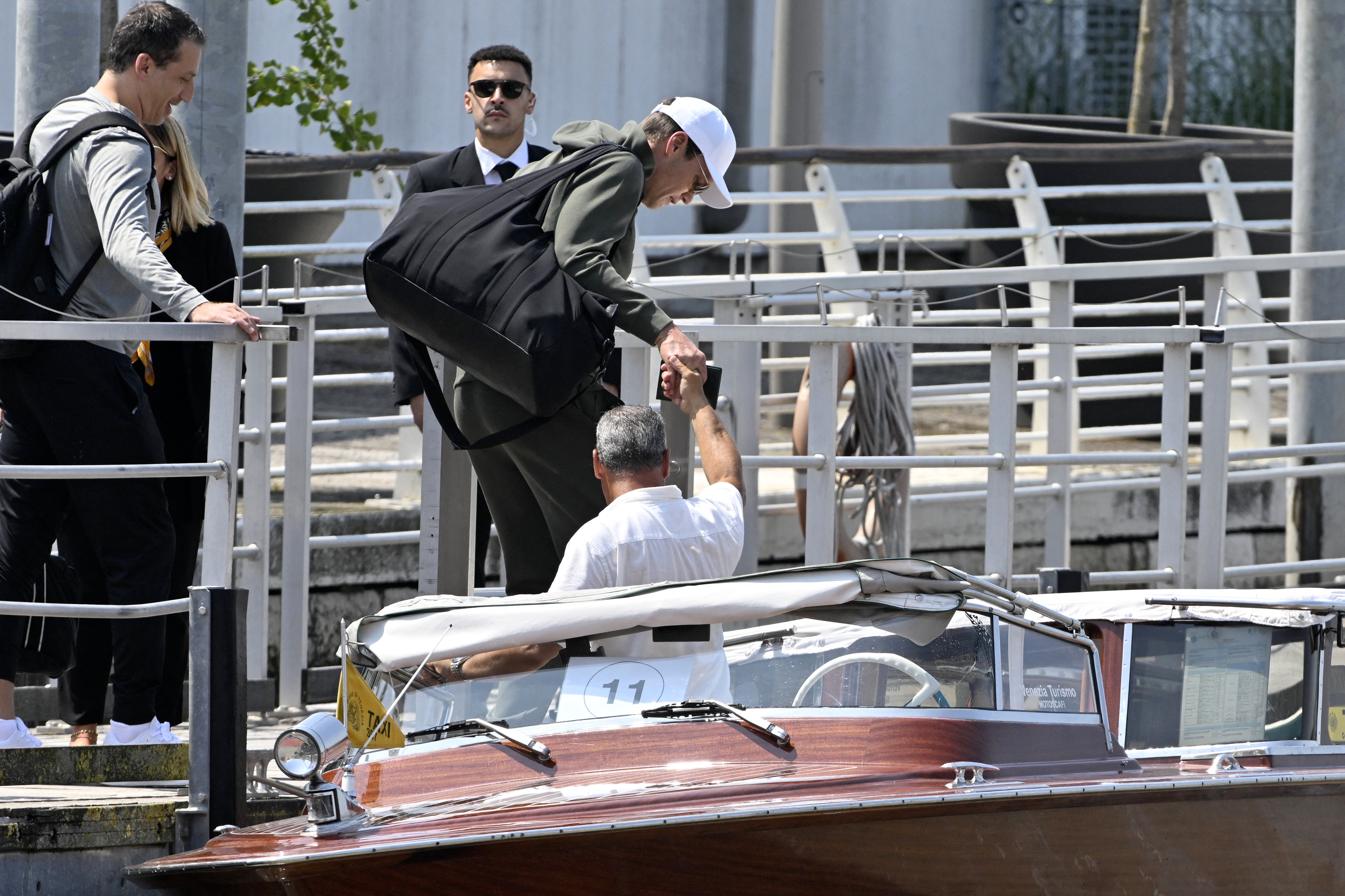 Tom Brady boards a taxi boat outside Venice Marco Polo airport