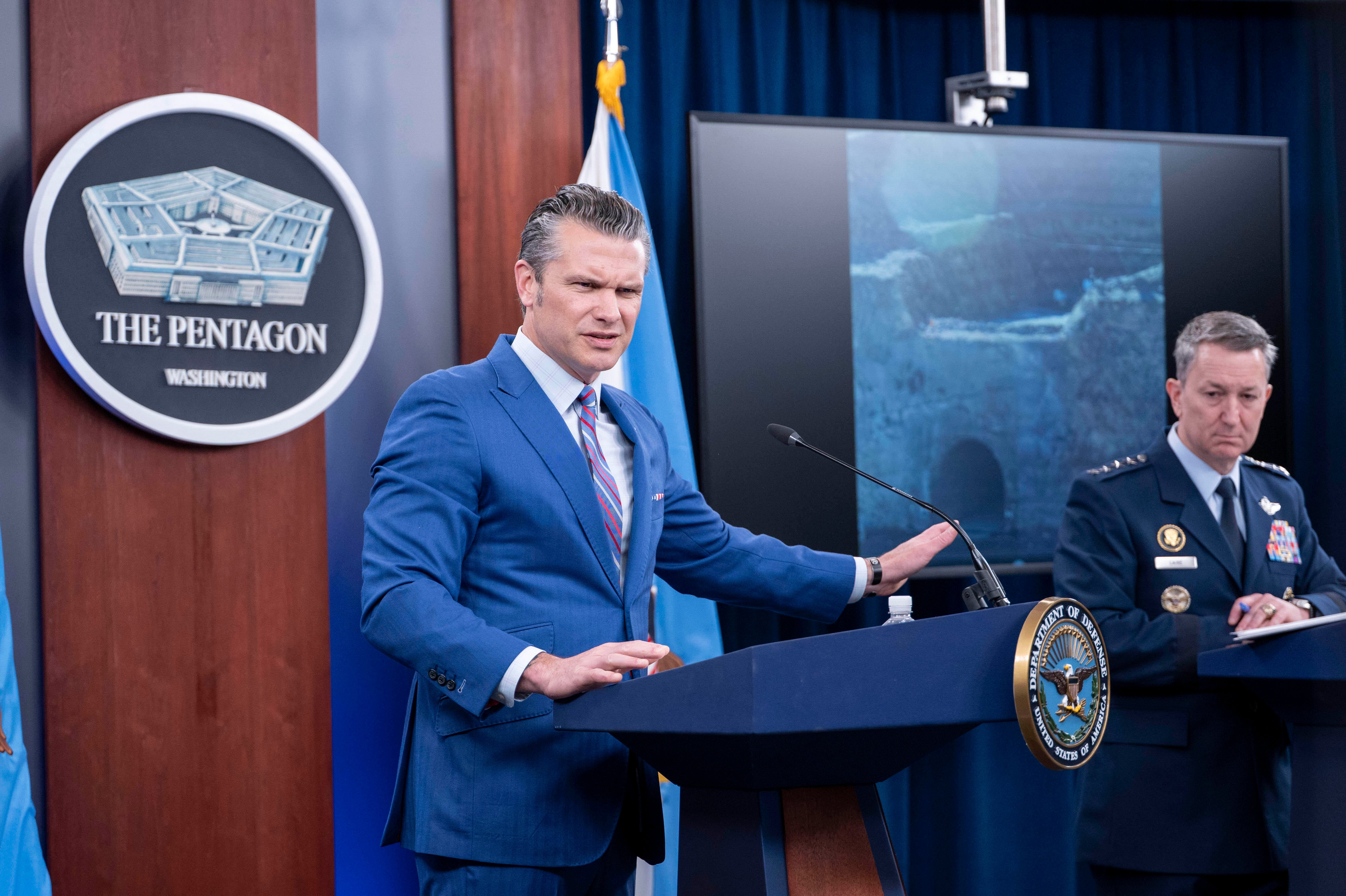 Defense Secretary Pete Hegseth and Joint Chiefs Chairman Gen. Dan Caine, right, take part in a news conference at the Pentagon, Thursday, June 26, 2025 in Washington.