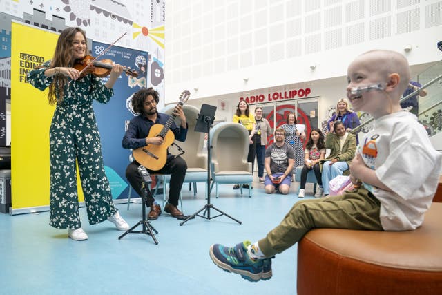 Violinist Nicola Benedetti and guitarist Plinio Fernandes performed for young patients at the Royal Hospital for Children & Young People in Edinburgh (Jane Barlow/PA)