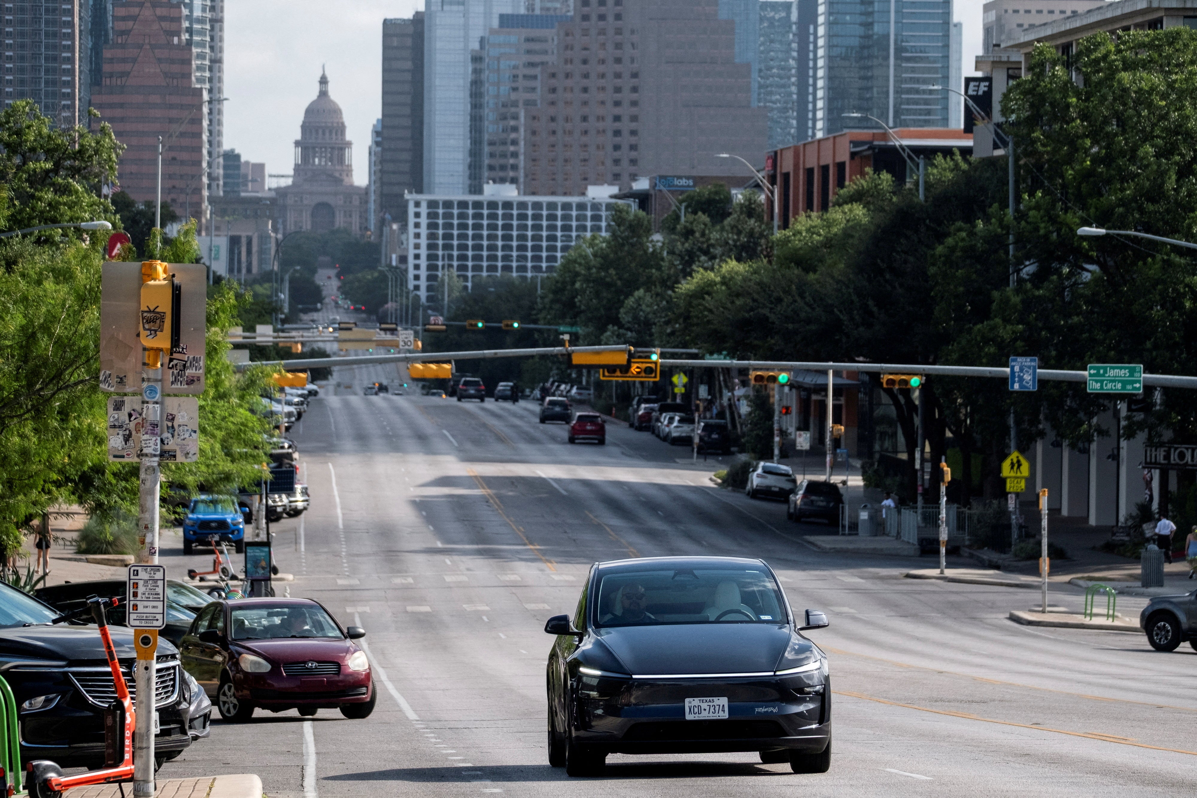 A robotaxi drives along South Congress Avenue in Austin, Texas