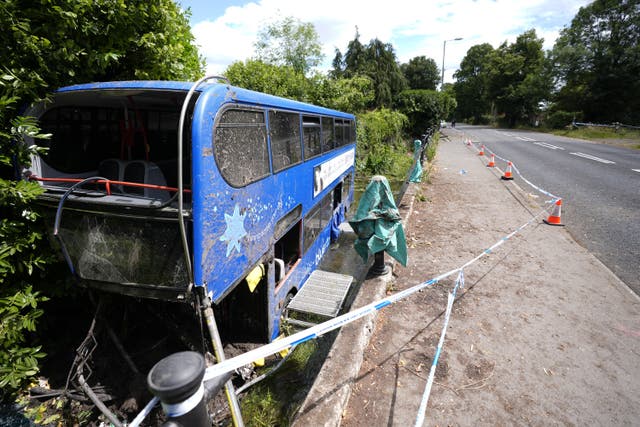 <p>The scene at Bishopstoke Road, Eastleigh, Hampshire, after a Blustar bus carrying pupils from Barton Peveril Sixth Form College came off the road and ended up in a river</p>