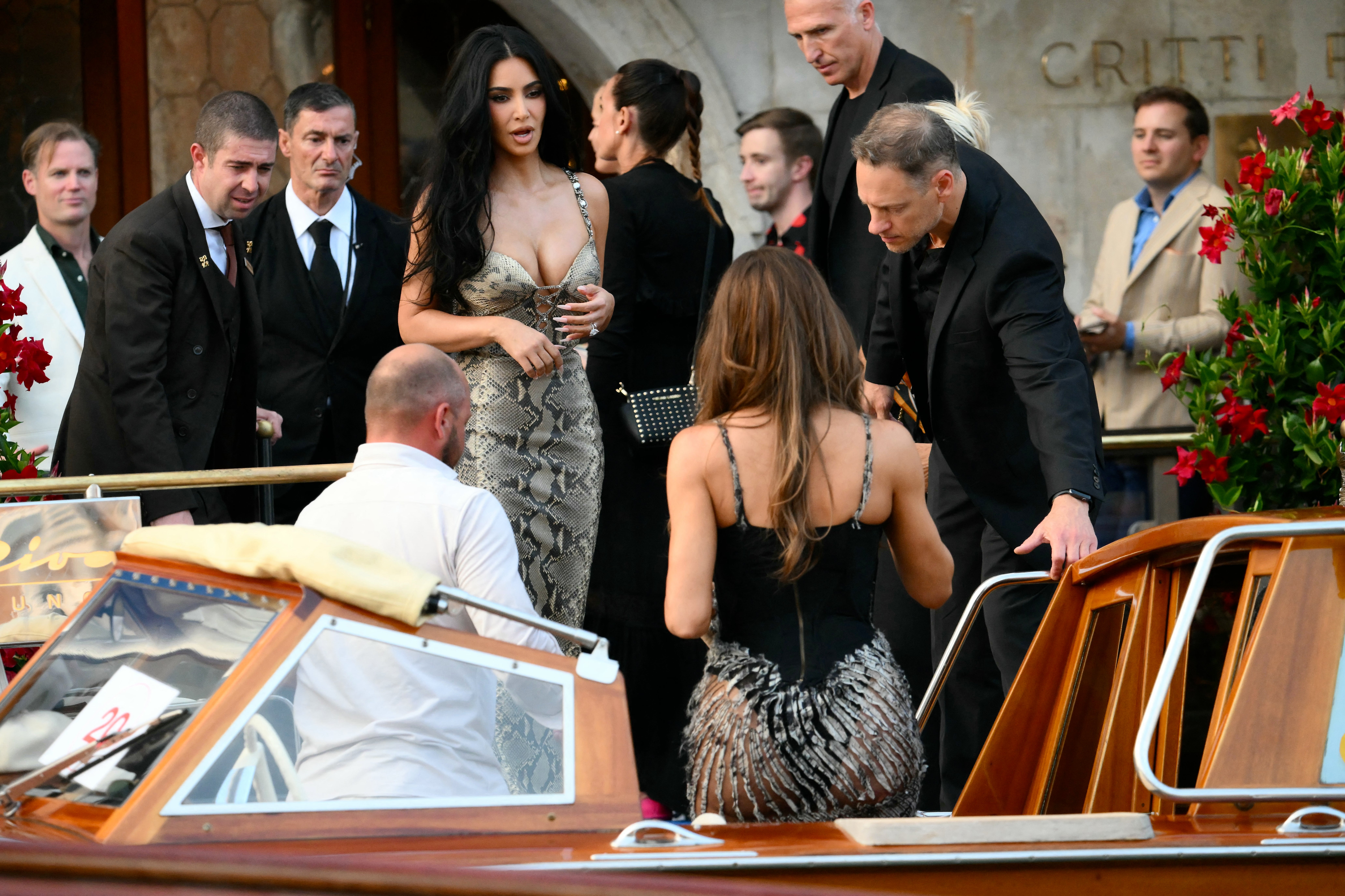 The Good American founder, who completed her look with a silver bracelet and black sunglasses, traveled in the water taxi on Thursday with her sister, Kim Kardashian