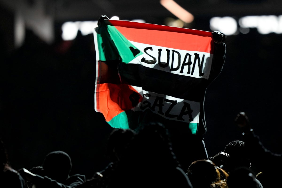 Super Bowl halftime performer arrested after police say he held flag stating Sudan and Free Gaza.