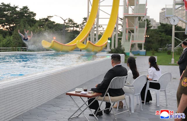 <p>Kim Jong Un was seen relaxing with his daughter and presumed heir at the bizarre beach resort</p>