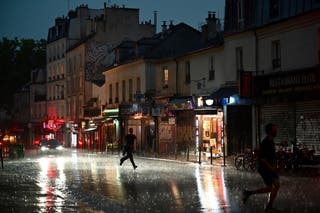 Deadly storms hit France as Paris streets flood and parliament springs
