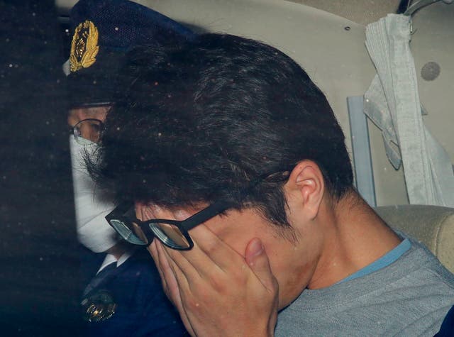 <p>Takahiro Shiraishi leaves a police station in Hachioji, suburbs of Tokyo, in November 2017</p>