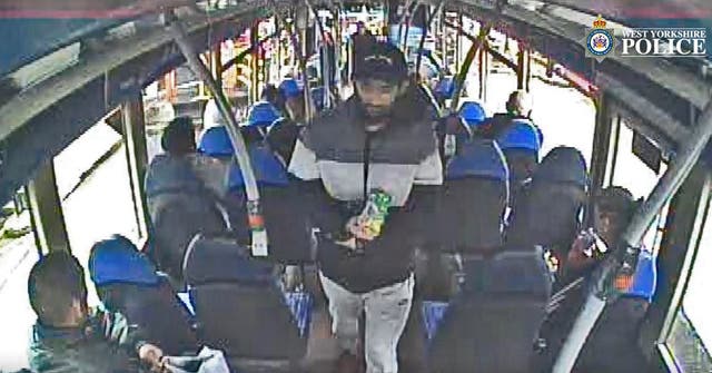 <p>Habibur Masum, 26, (centre) on a bus prior to him attacking his wife (West Yorkshire Police/PA)</p>