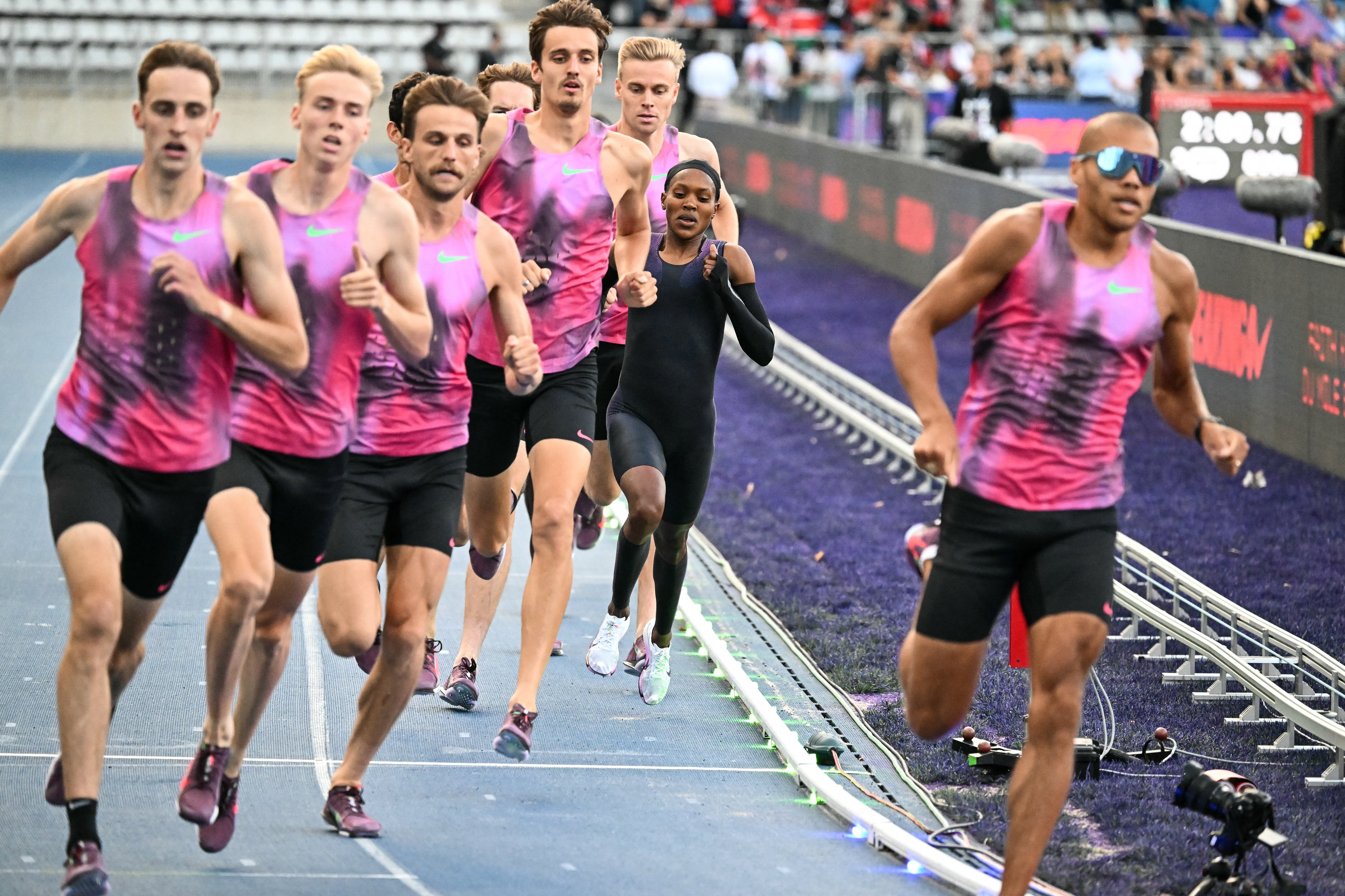 Faith Kipyegon, from Kenya, runs in an attempt to become the first woman to run a mile in under four minutes