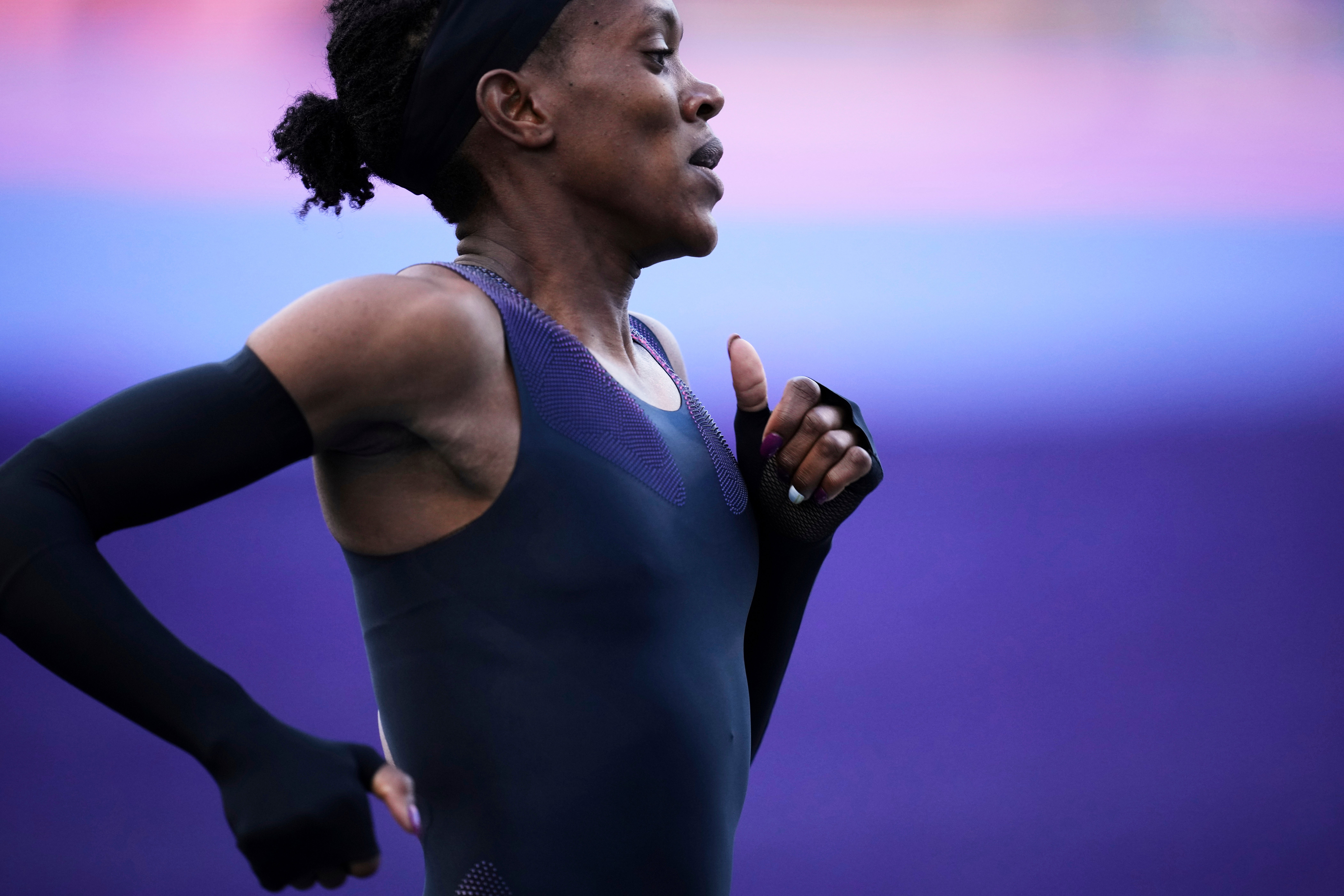Faith Kipyegon, from Kenya, runs in an attempt to become the first woman to run a mile in under four minutes
