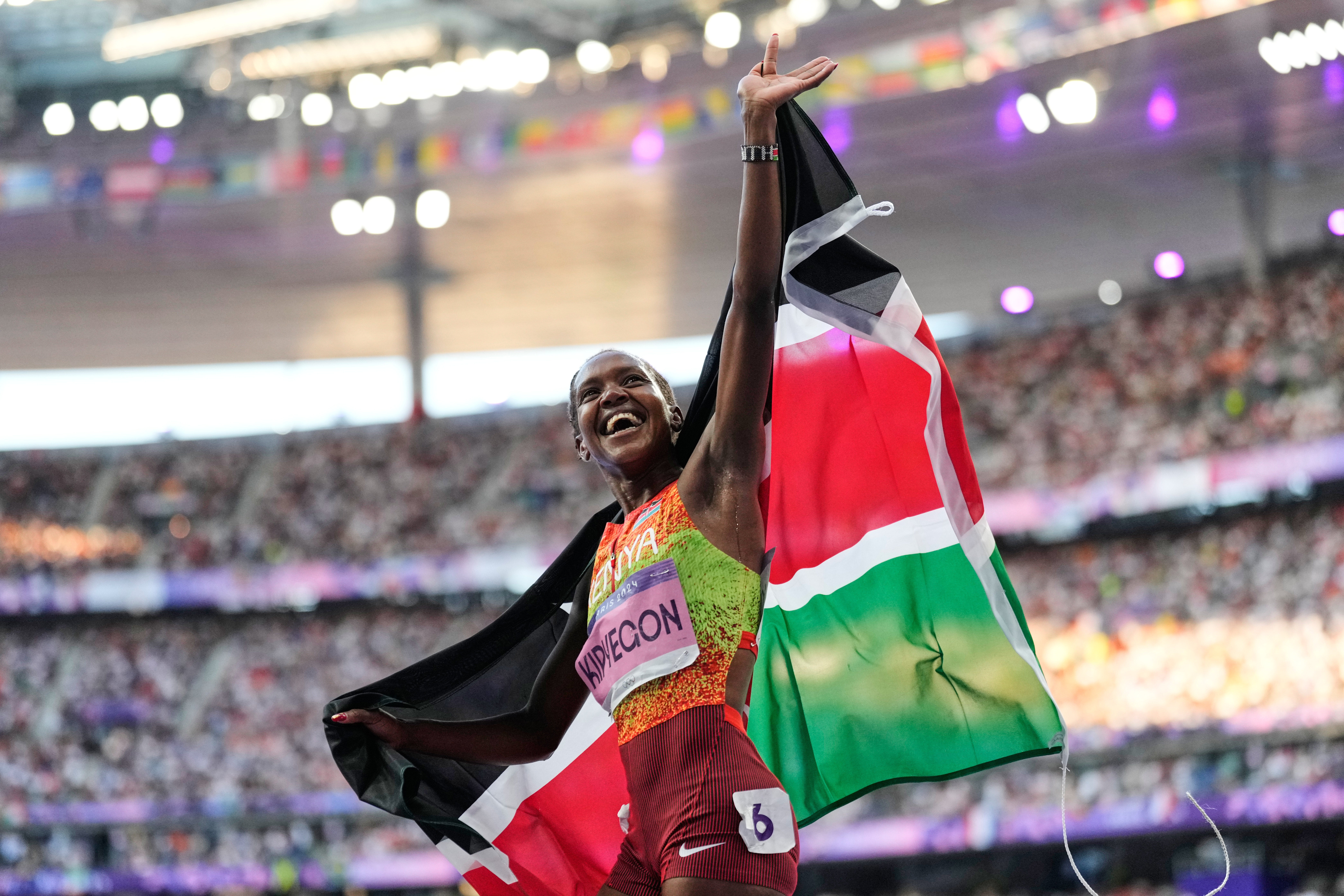 Kenya, celebrates after winning the gold medal in the women's 1500 meters final at the 2024 Summer Olympics