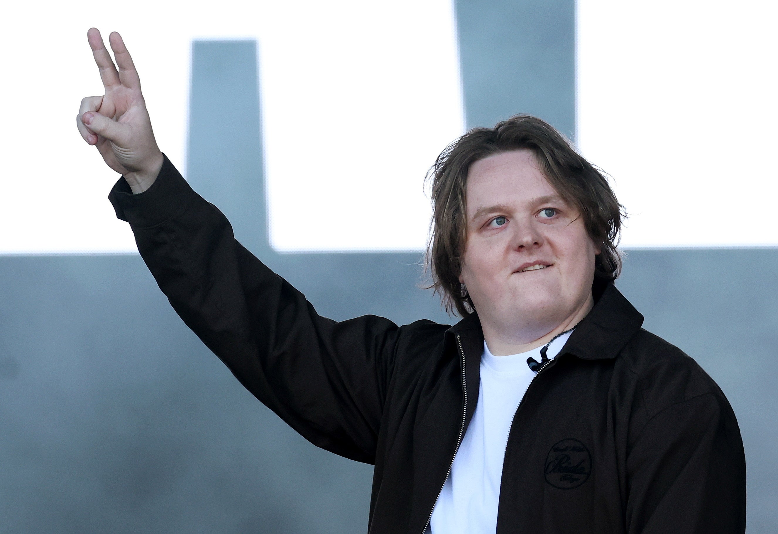<p>Lewis Capaldi gestures as he performs on the Pyramid Stage during day three of the Glastonbury Festival at Worthy Farm</p>