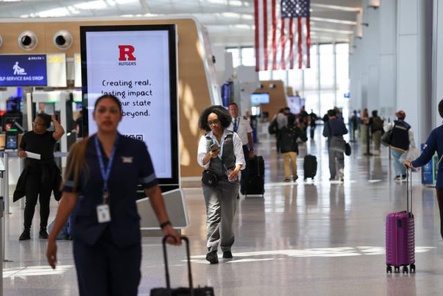<p>People move through Newark Liberty International Airport </p>