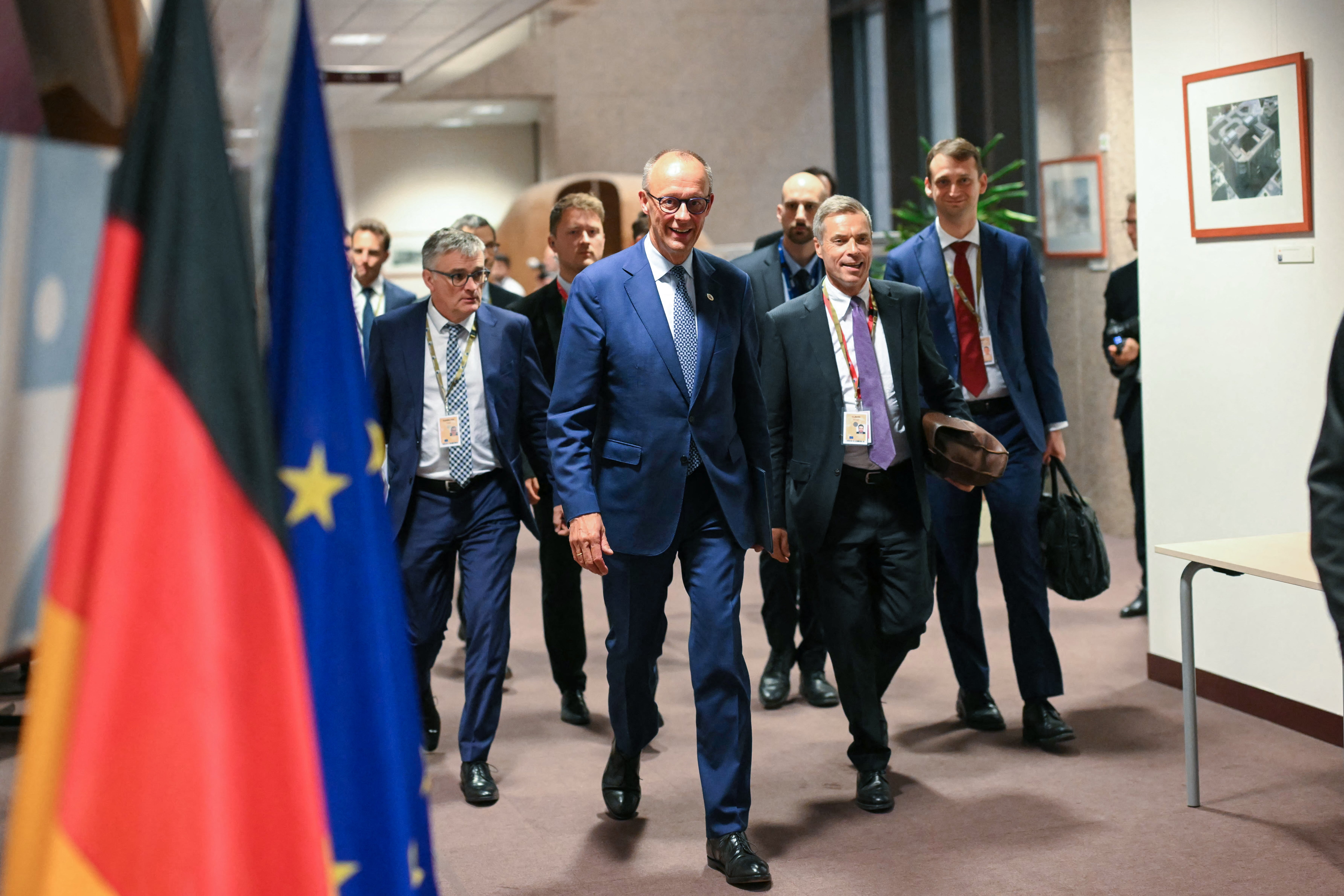 Germany's chancellor Friedrich Merz arrives to hold a press conference after working sessions at the European Council in Brussels
