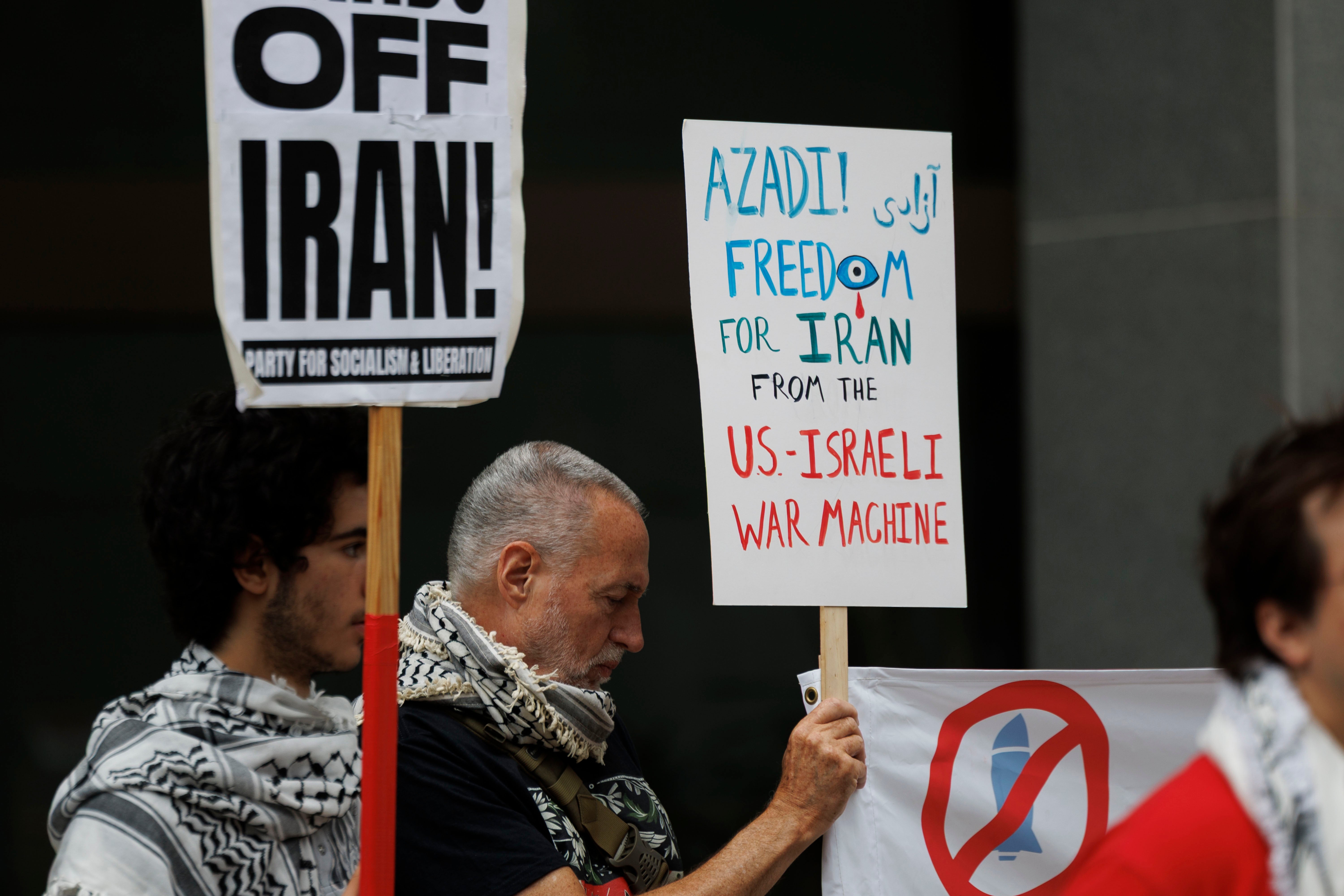 Protesters rally outside the JFK Federal Building