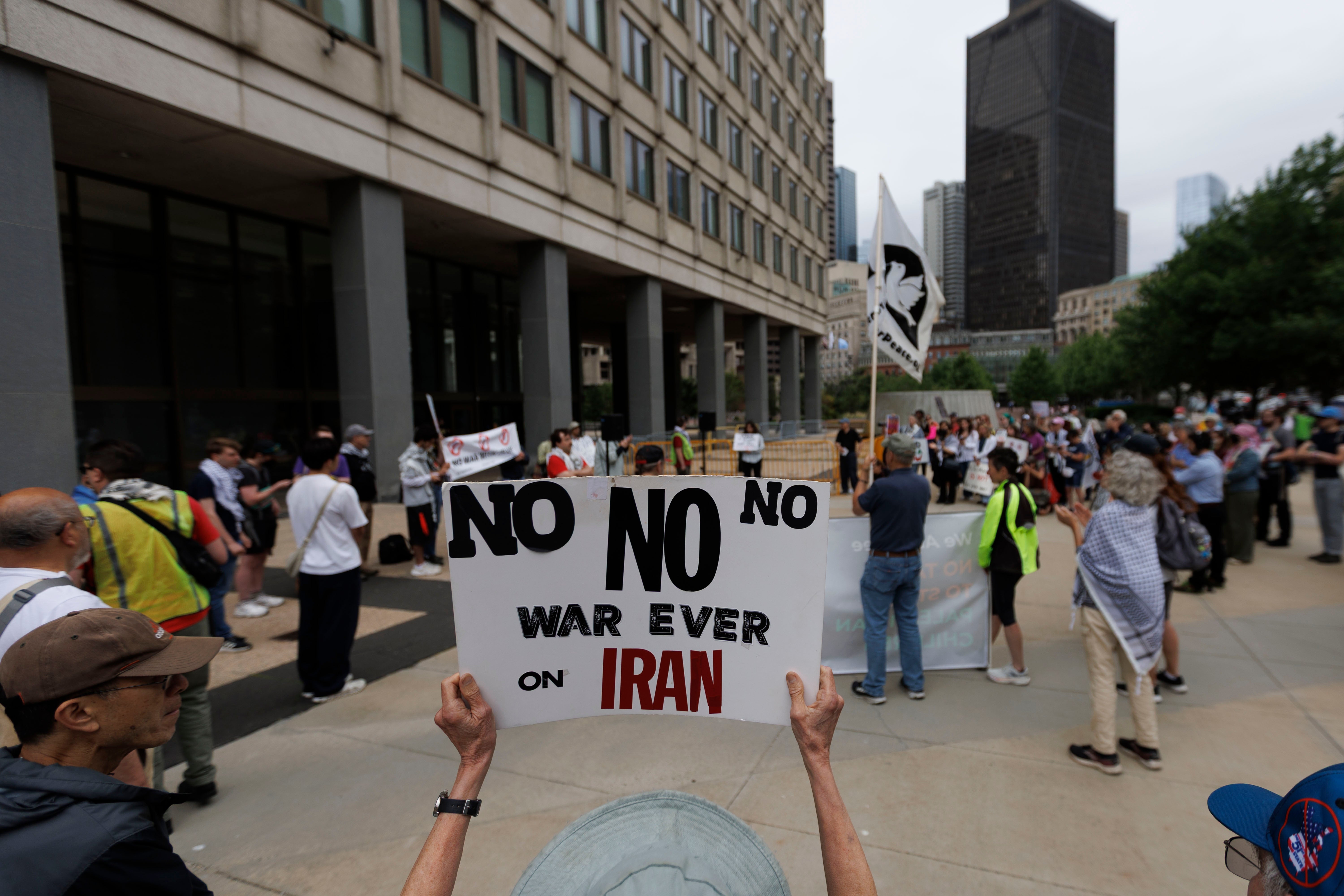 Protesters rally outside the JFK Federal Building