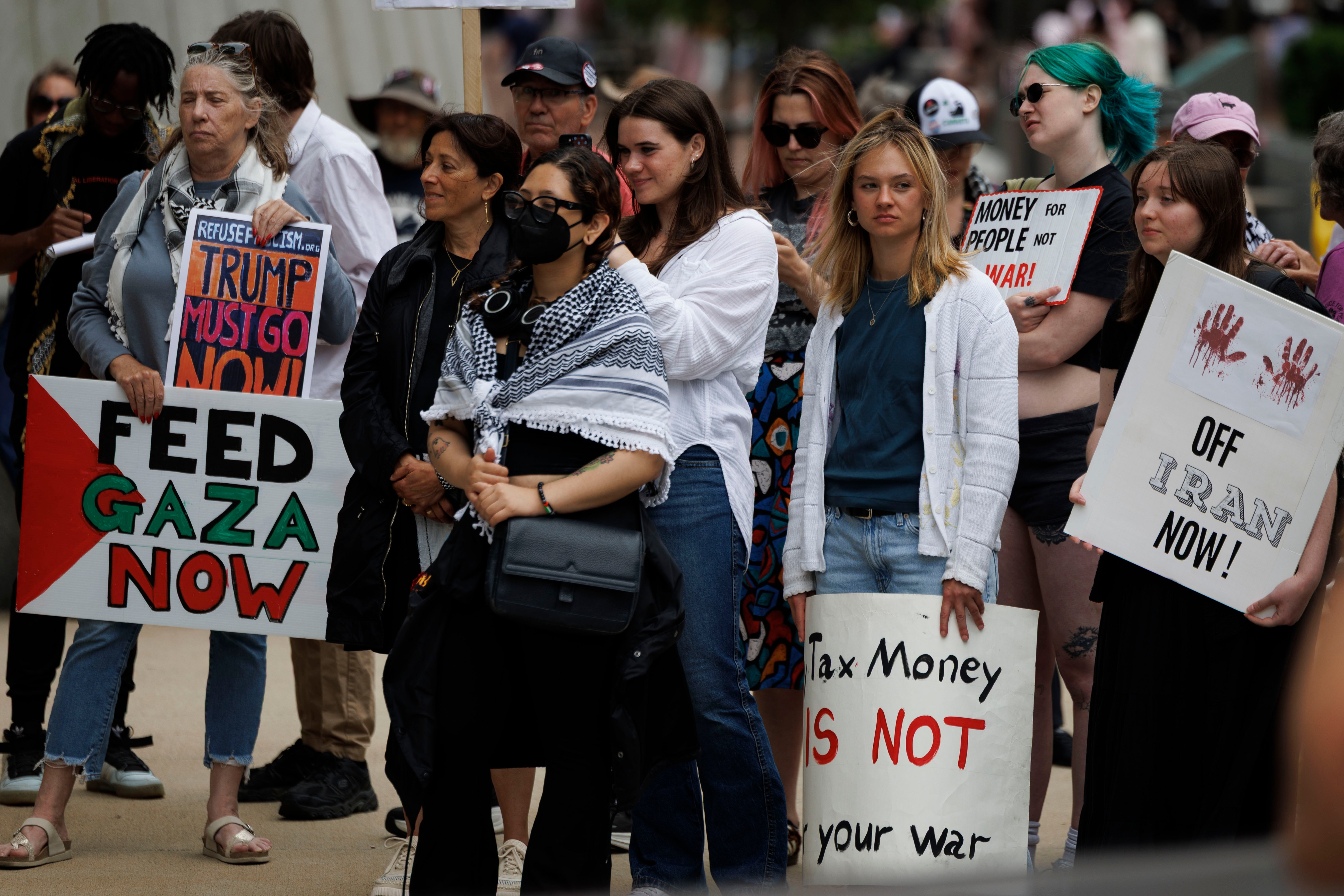 Protesters rally outside the JFK Federal Building