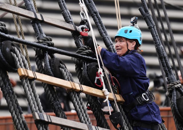 <p>Lorraine Kelly looked uncertain as the climbed the rigging (Andrew Milligan/PA)</p>