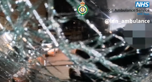 Moment patient throws bricks at paramedics and attacks ambulance
