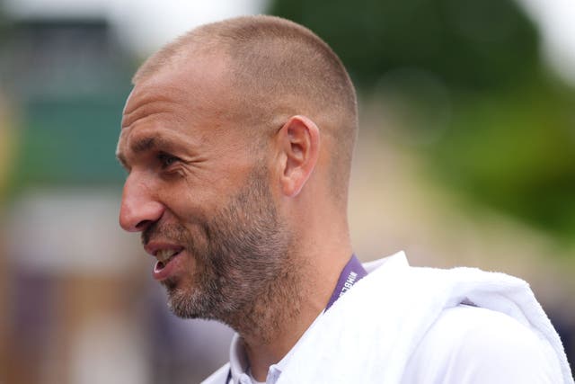 Dan Evans walks to practice at Wimbledon (John Walton/PA)