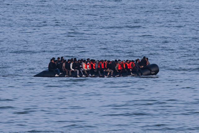 <p>Migrants sail onboard a smuggler's boat in an attempt to cross the English Channel off the beach of Neufchatel-Hardelot, northern France on June 18, 2025</p>