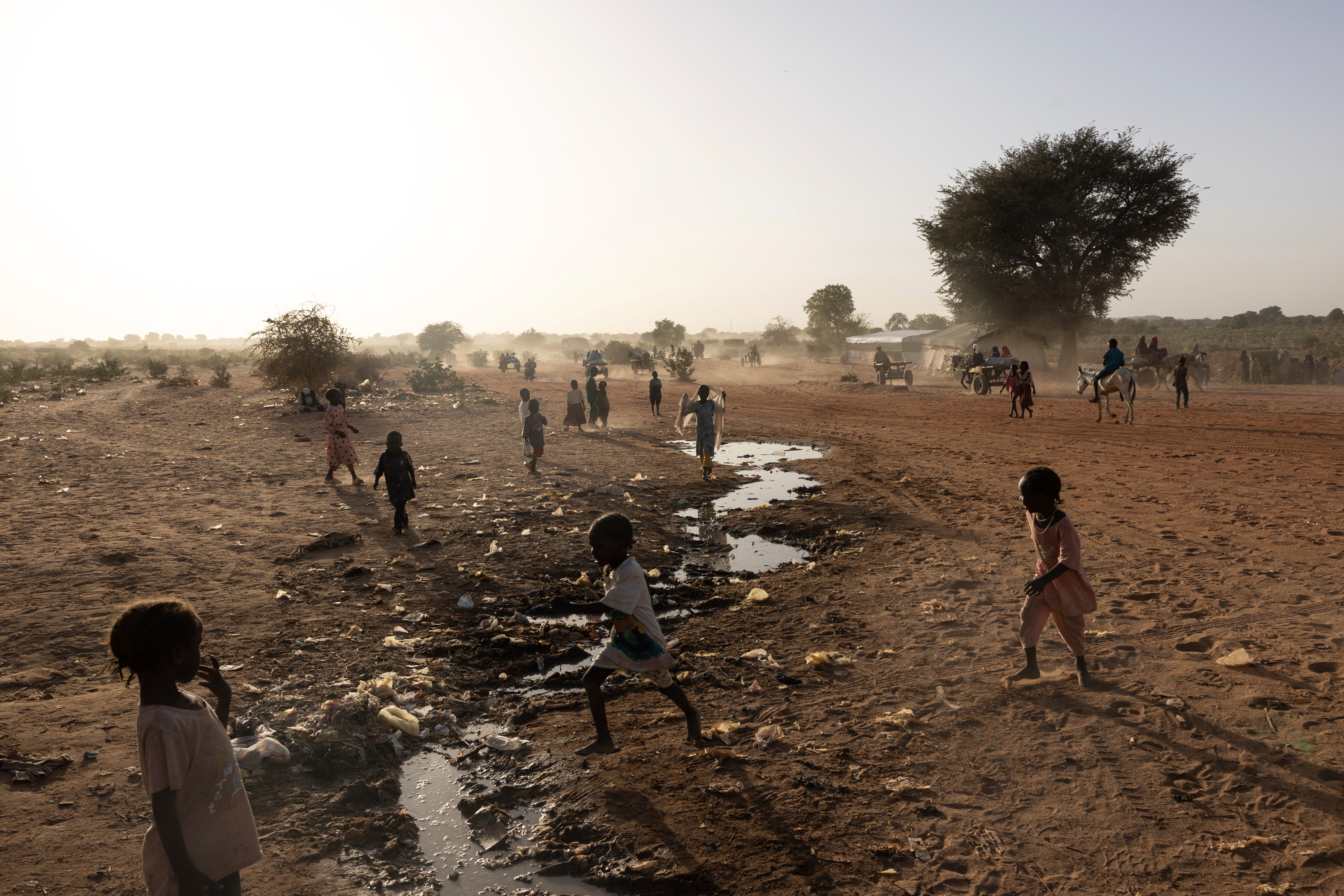 Children play by the Sudanese border in a Chad refugee camp