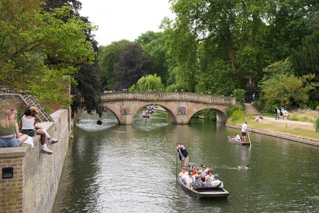 People punting along the River Cam in Cambridge, as the warm weather continues across the country (Joe Giddens/PA)