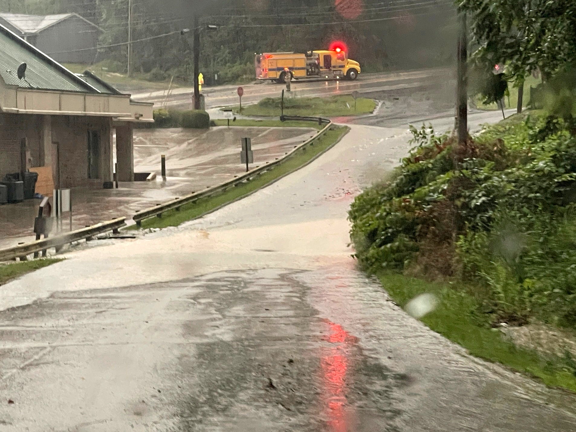Water, mud and debris cover National Road in Wheeling, West Virgina