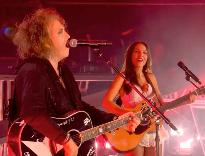 Olivia Rodrigo and Robert Smith during her headline Glastonbury set