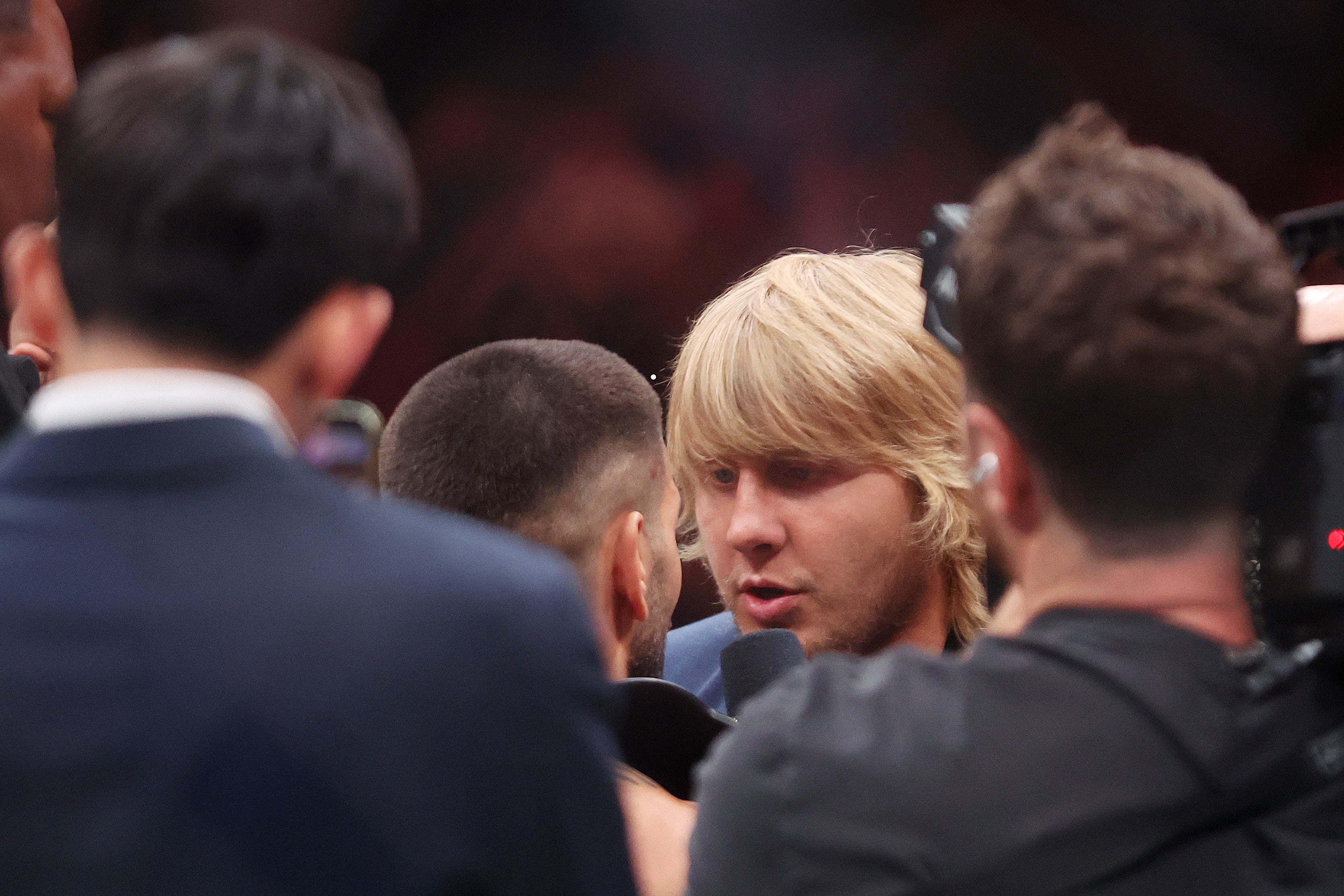 Paddy Pimblett (right) facing Topuria
