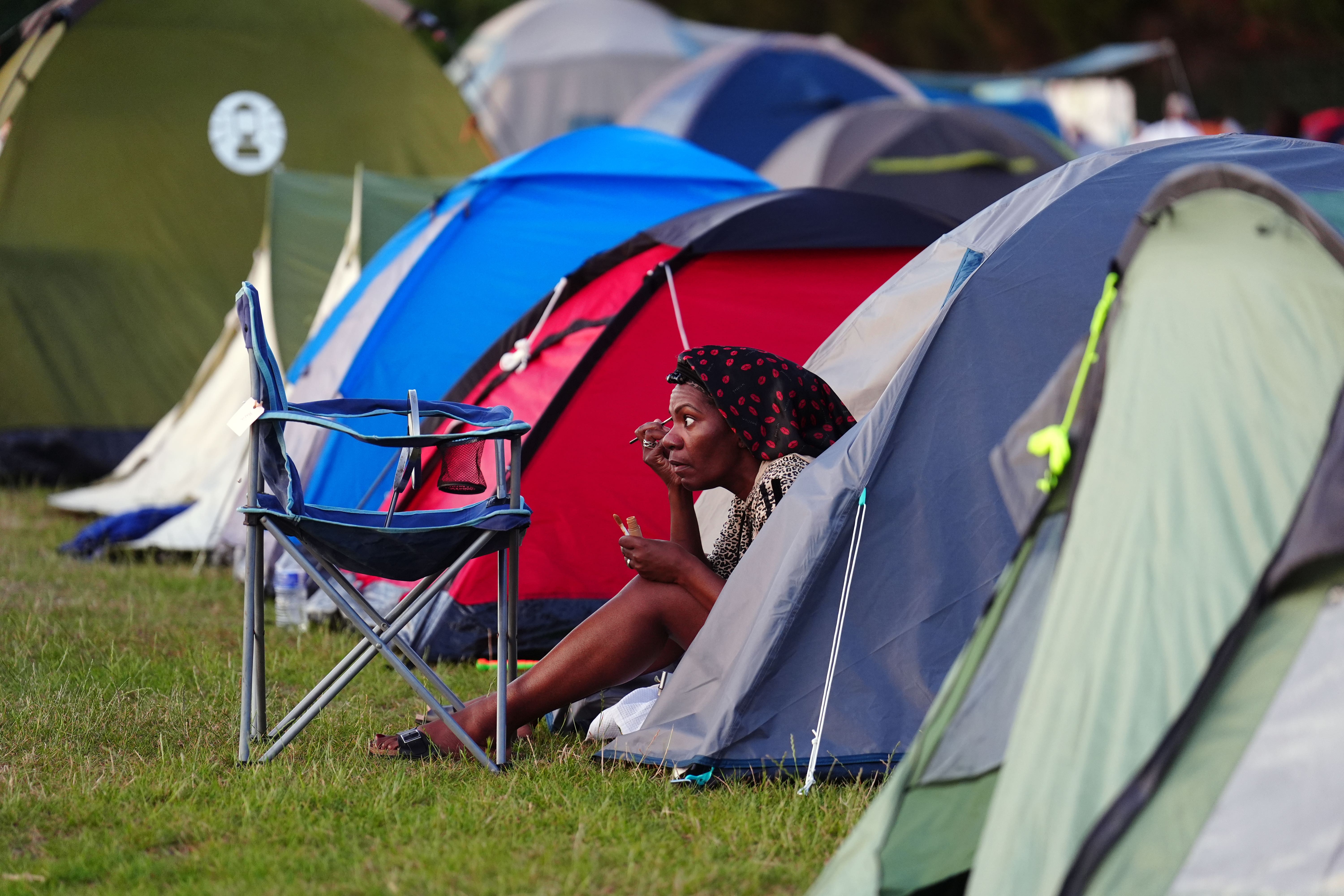 A spectator in the overnight on day one of the 2025 Wimbledon Championships (Mike Egerton/PA)
