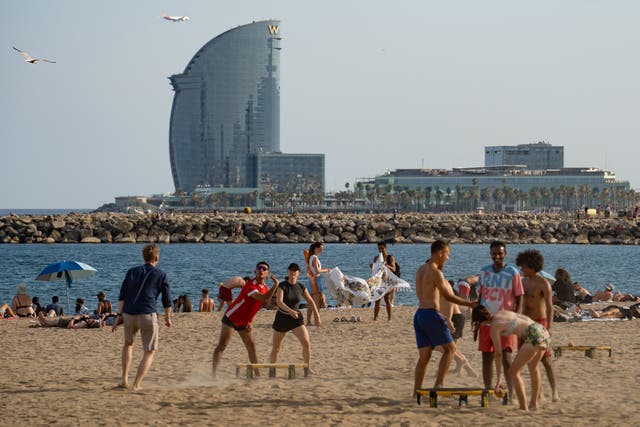 <p>People at Barceloneta beach in Barcelona, on June 27, 2025, a day before the first heatwave of the year is officially expected to begin</p>