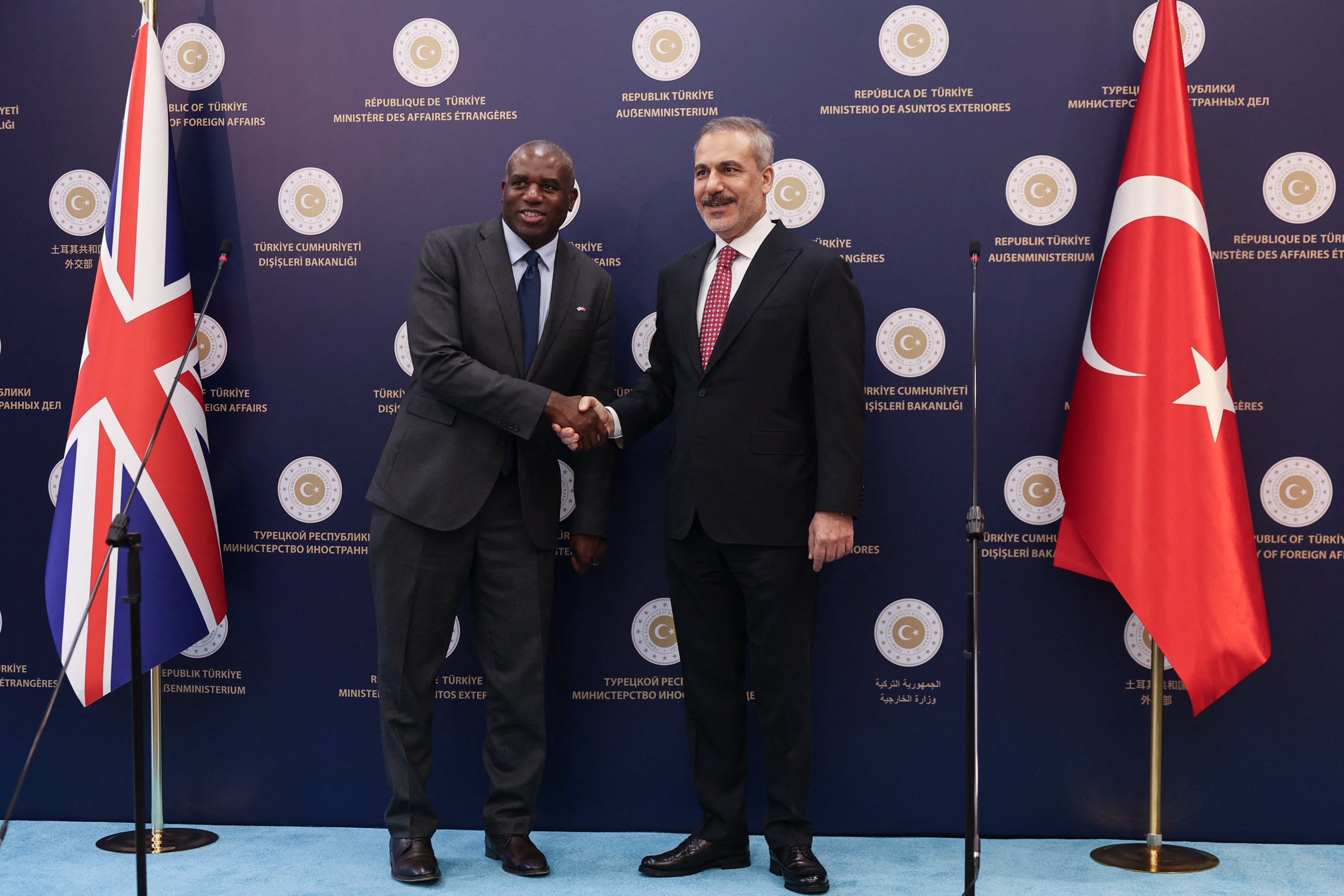 Turkish foreign minister Hakan Fidan shakes hand with British foreign secretary David Lammy at the end of their joint press conference following their meeting in Ankara