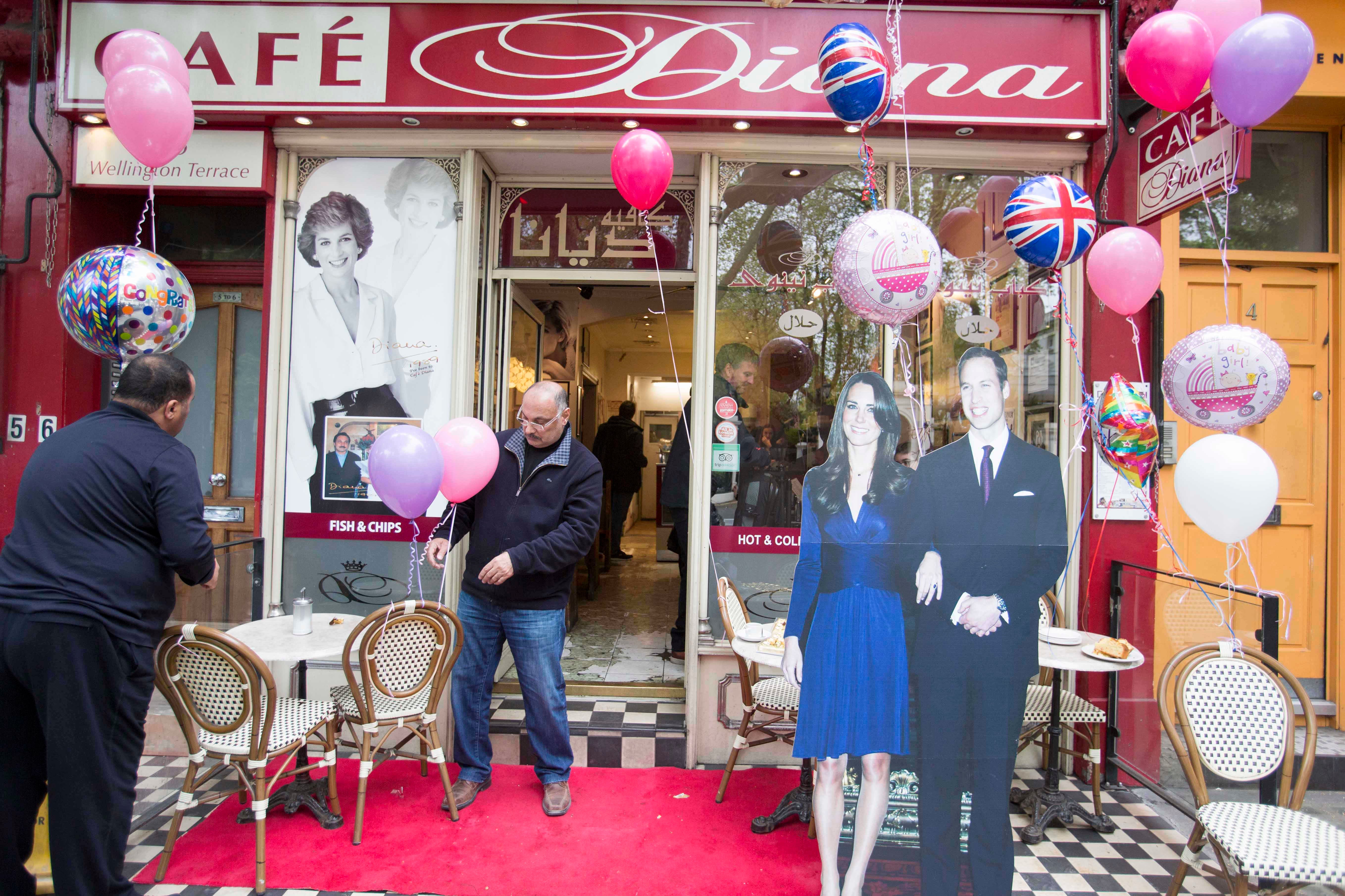 The café celebrates the birth of William and Kate's daughter Charlotte with balloons and a cardboard cut out of the couple