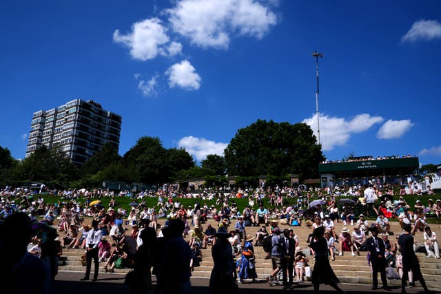 A general view of the hill as spectators look to take shelter from the sun on day one of the 2025 Wimbledon Championships (John Walton/PA)