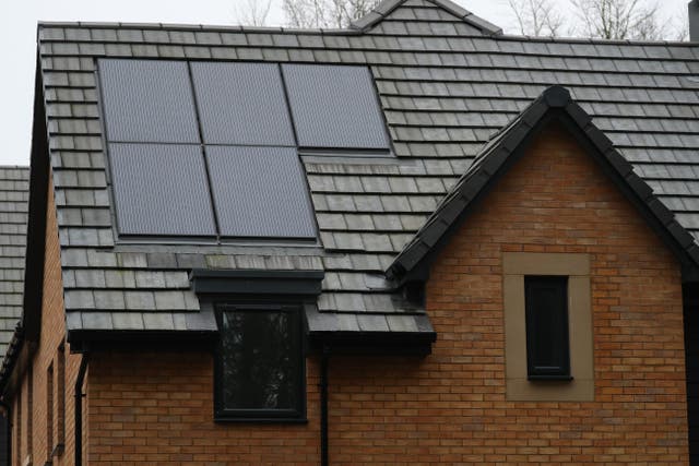 Solar panels on a house roof (Andrew Matthews/PA)