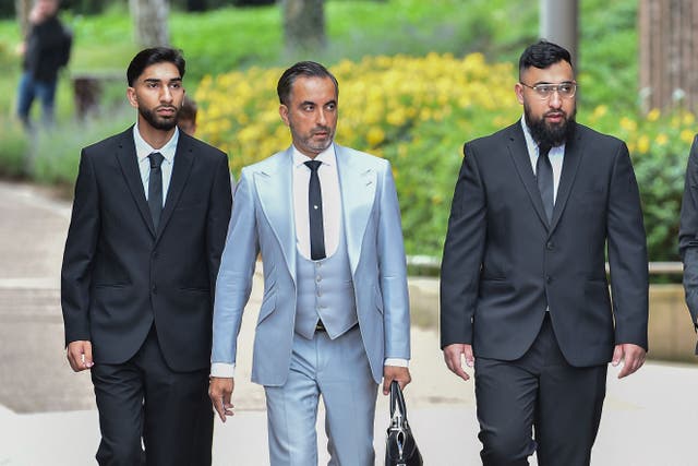 Lawyer Aamer Anwar (second left) arrives with Mohammed Fahir Amaaz (left) and Muhammed Amaad (second right) at Liverpool Crown Court (Peter Powell/PA)