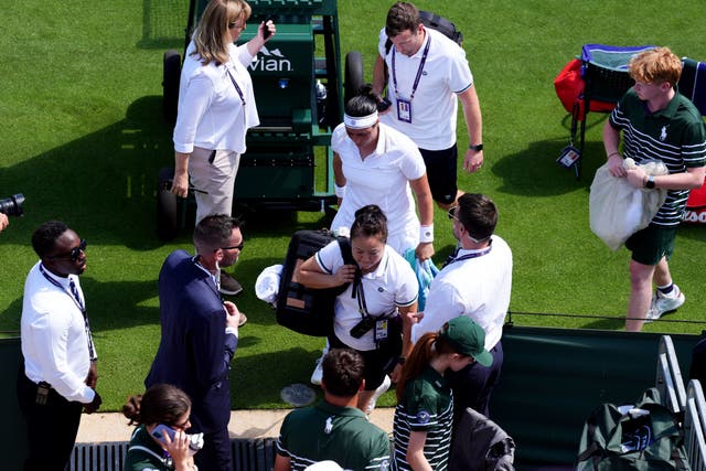 Ons Jabeur leaves the court for a medical time out (John Walton/PA)