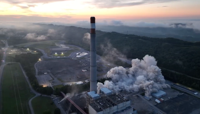 <p>Moment 152-metre-high chimneys at power station crumble to ground in blast</p>