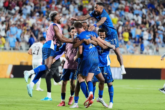 Al-Hilal’s players celebrate after beating Manchester City (John Raoux/AP)