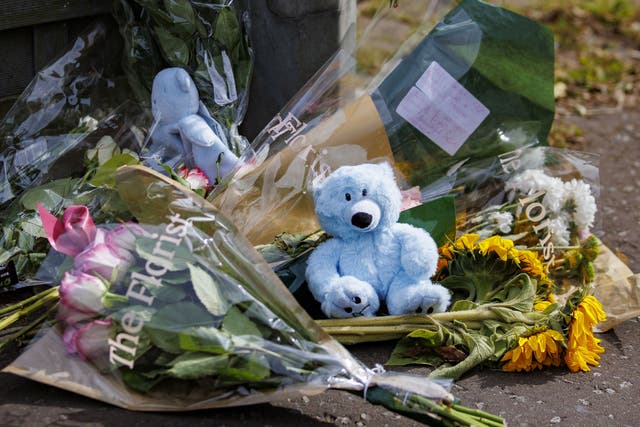 Floral tributes and teddy bears placed in Elmfield Walk area of Donaghadee, Co Down (Liam McBurney/PA)