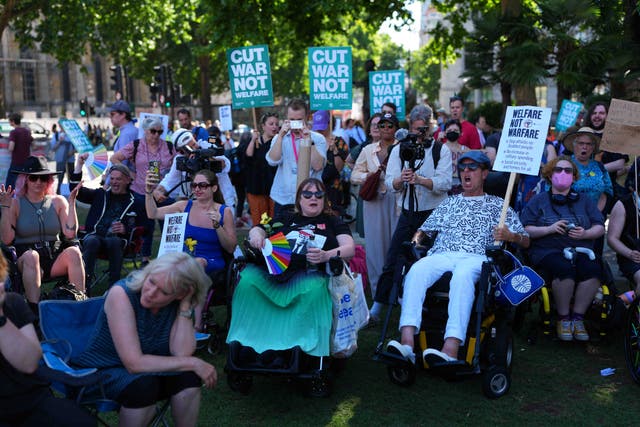<p>The planned welfare cuts drew protests </p>