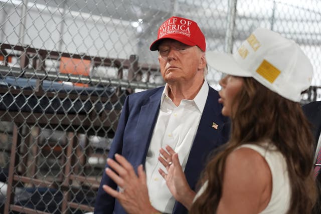 <p>President Donald Trump listens to Homeland Security Secretary Kristi Noem, as they and others tour "Alligator Alcatraz," a new migrant detention facility at Dade-Collier Training and Transition facility, Tuesday, July 1, 2025, in Ochopee, Florida</p>