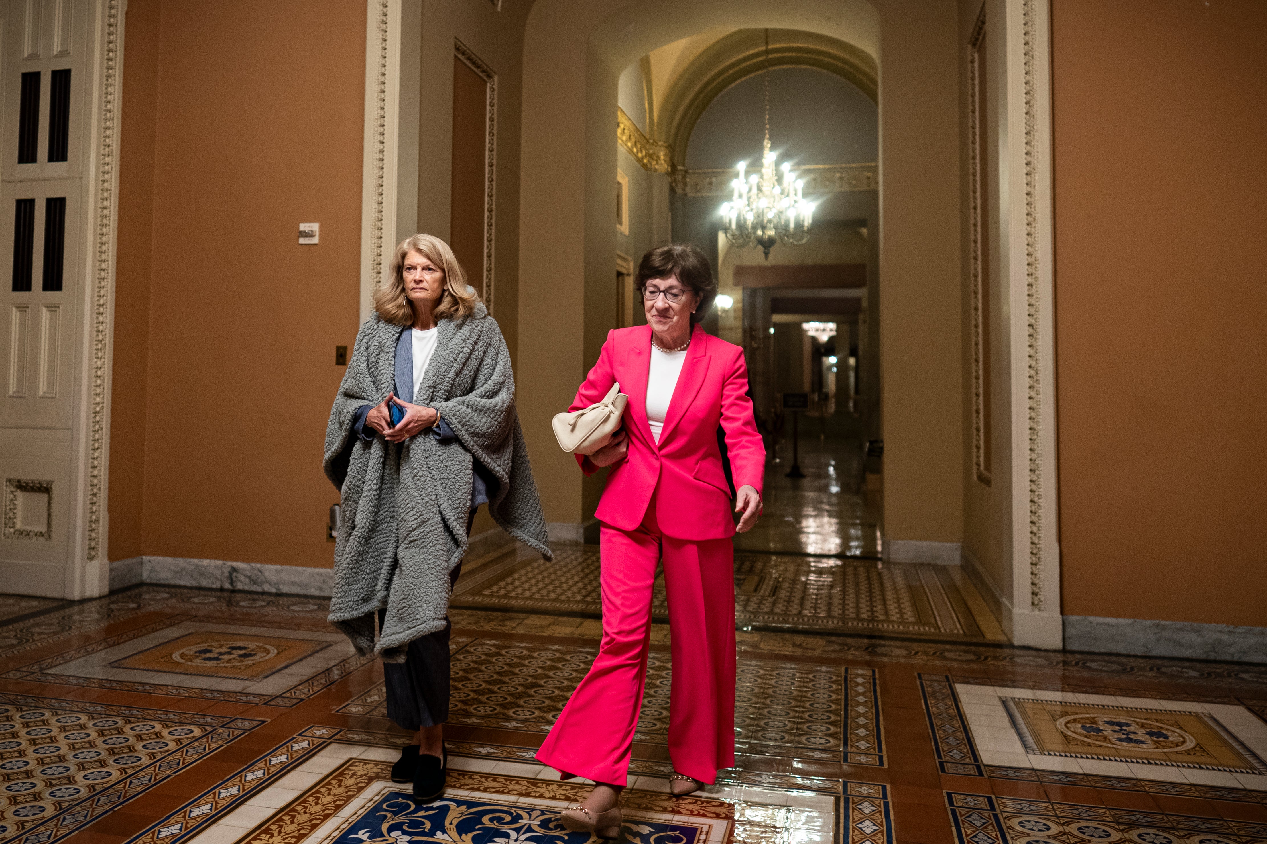 (L-R) U.S. Sen. Lisa Murkowski (R-AK) and U.S. Sen. Susan Collins (R-ME) walk to the Senate floor during overnight votes at the U.S. Capitol on July 1, 2025 in Washington, DC. Republican leaders are pushing to get President Donald Trump's so-called 
