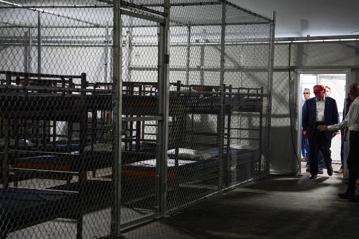 Photos of Trump touring an immigration detention center dubbed 'Alligator Alcatraz'