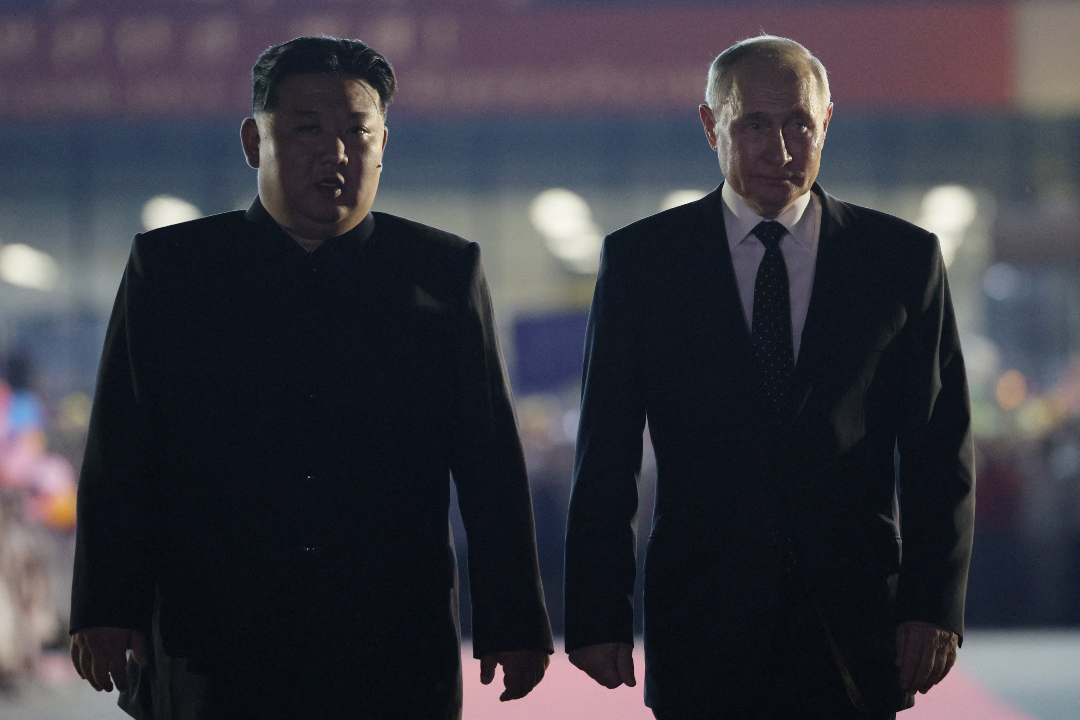  Russian president Vladimir Putin and North Korean leader Kim Jong Un walk during a farewell ceremony upon Putin's departure at the Sunan International Airport in Pyongyang on 19 June 2024