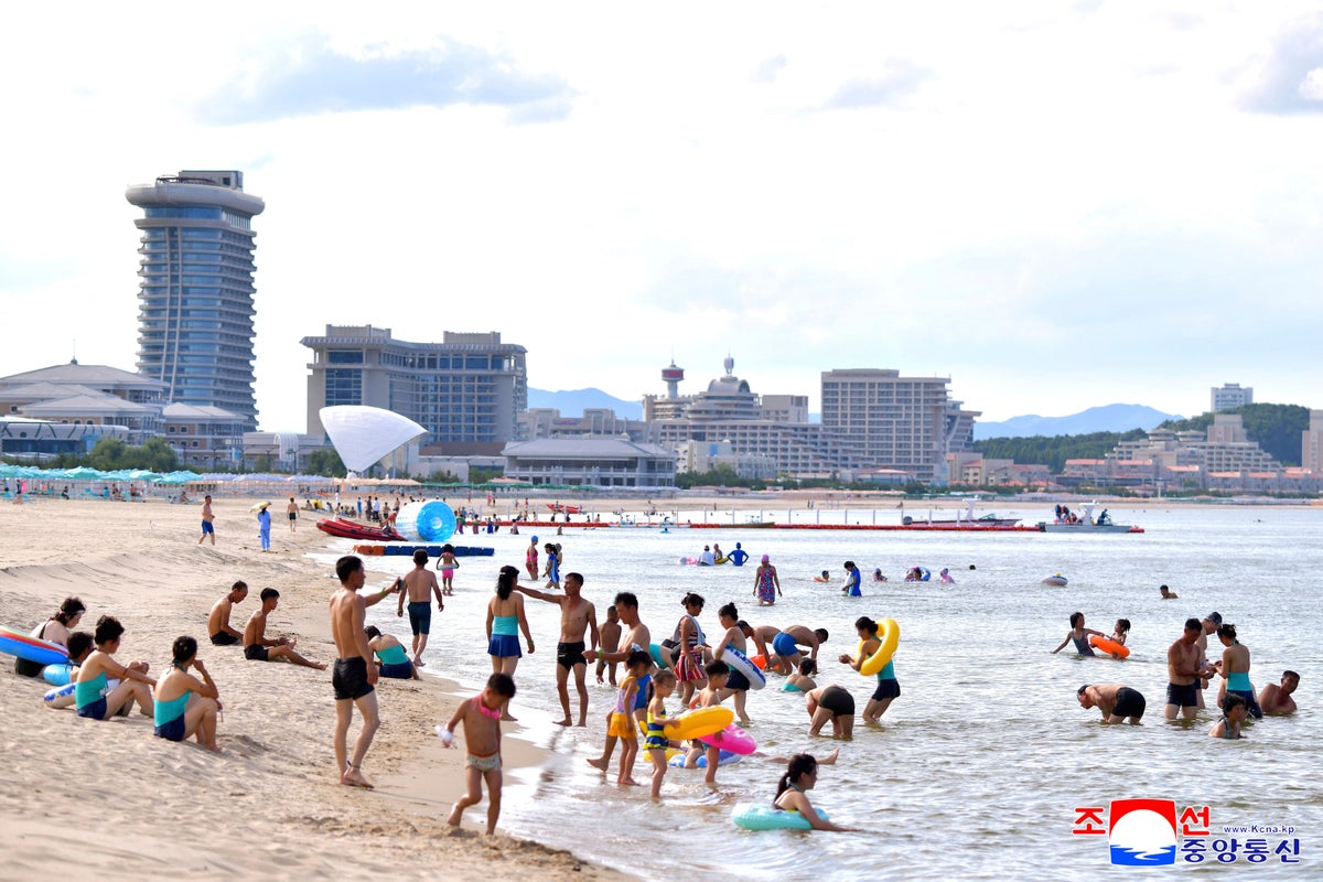 North Koreans swim and play at a beach resort touted as a boost for tourism