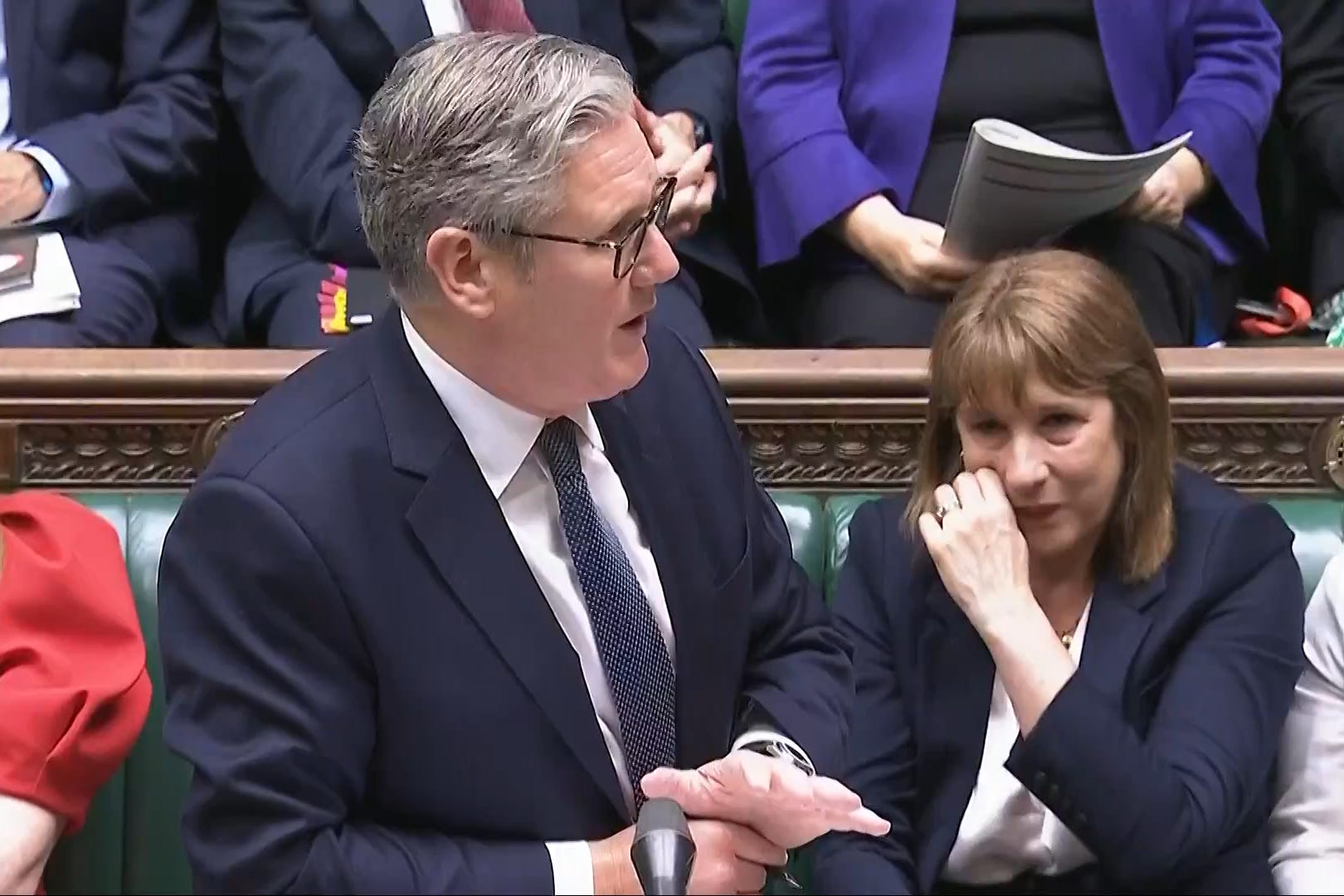 Chancellor of the Exchequer Rachel Reeves (right) crying as Prime Minister Sir Keir Starmer speaks during Prime Minister’s Questions (House of Commons/UK Parliament/PA)