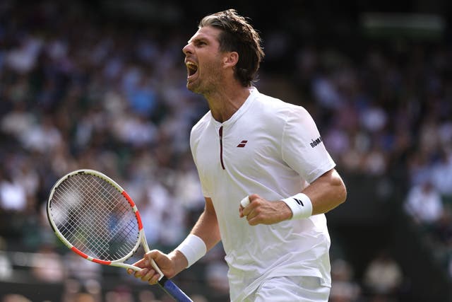 Cameron Norrie celebrates breaking serve in the fourth set during the match against Frances Tiafoe on day three of the 2025 Wimbledon Championships (Jordan Pettitt/PA)